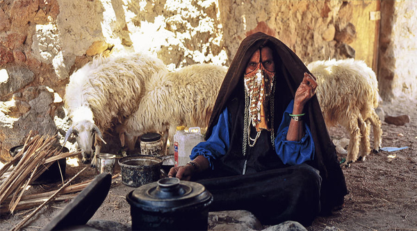 A Bedouin woman at her kitchen Bedouins food.