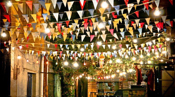 Street decorated with flags during Ramadan.