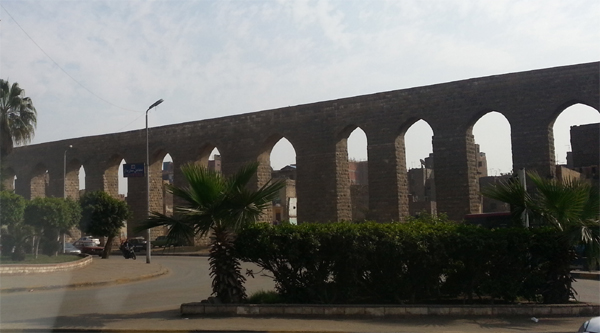 Part of the aqueduct running along a street in Cairo