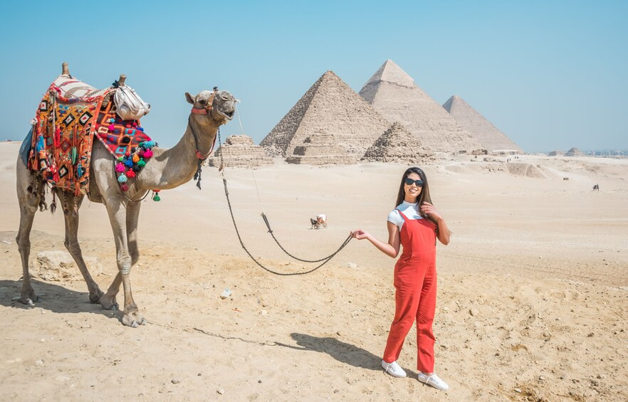 Solo female traveller camel riding experience at the pyramids